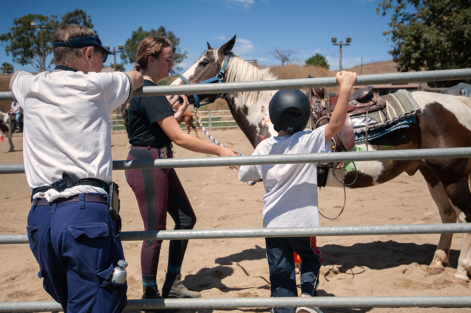 stepp-stables_summer-camp-child-waiting-to-get-on-horse.jpg